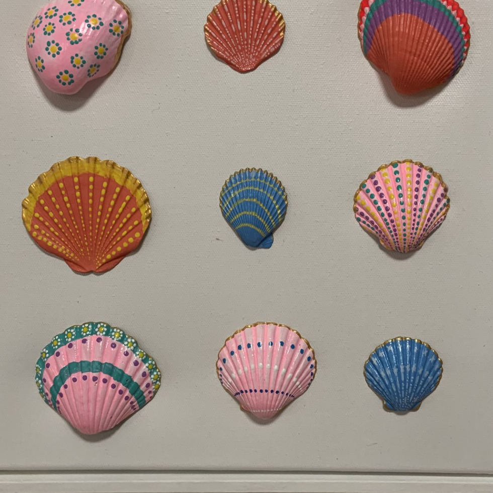 Close-up of hand-painted sea shells artwork by Julie Liu